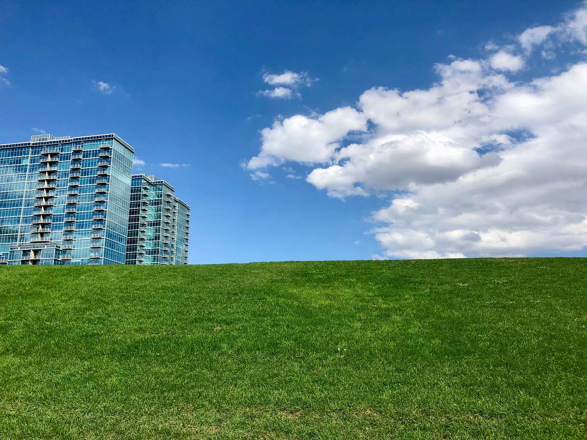 city curtain wall high-rise building under blue sky high rise