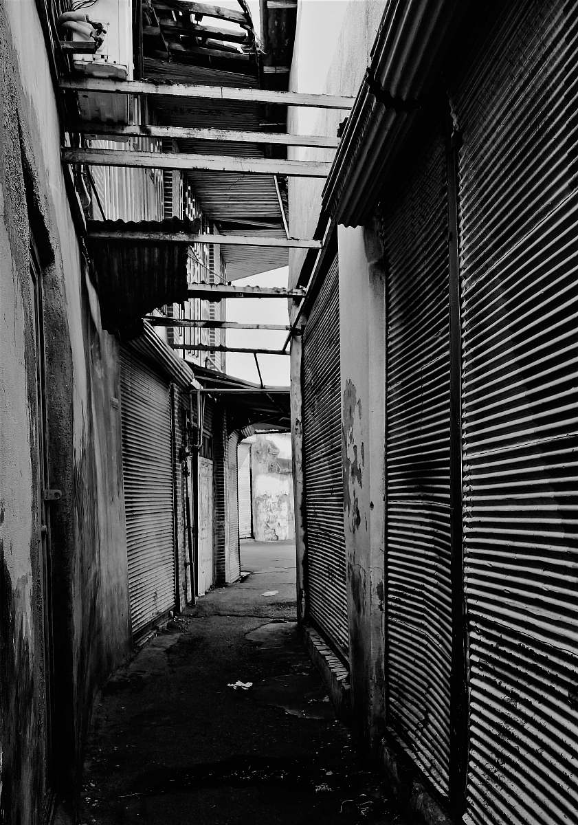city empty alley in monochrome photo black-and-white