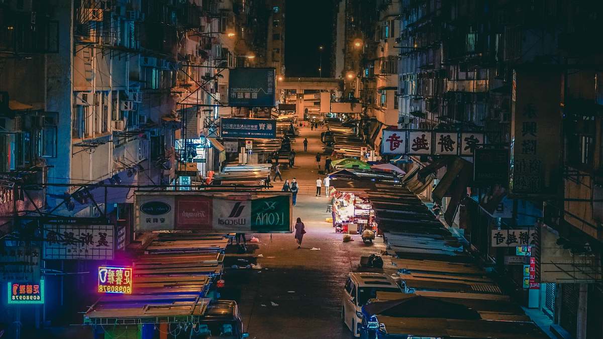 city flea market surrounded by buildings metropolis