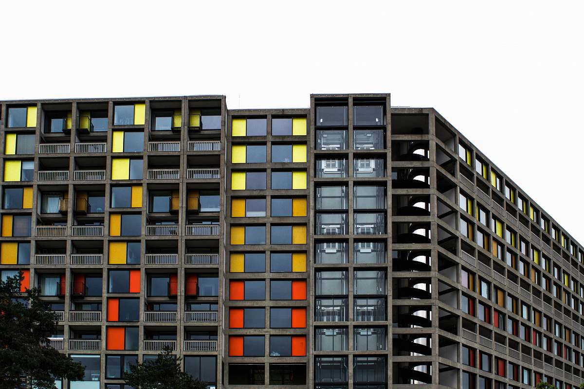 city gray and black concrete building at daytime high rise