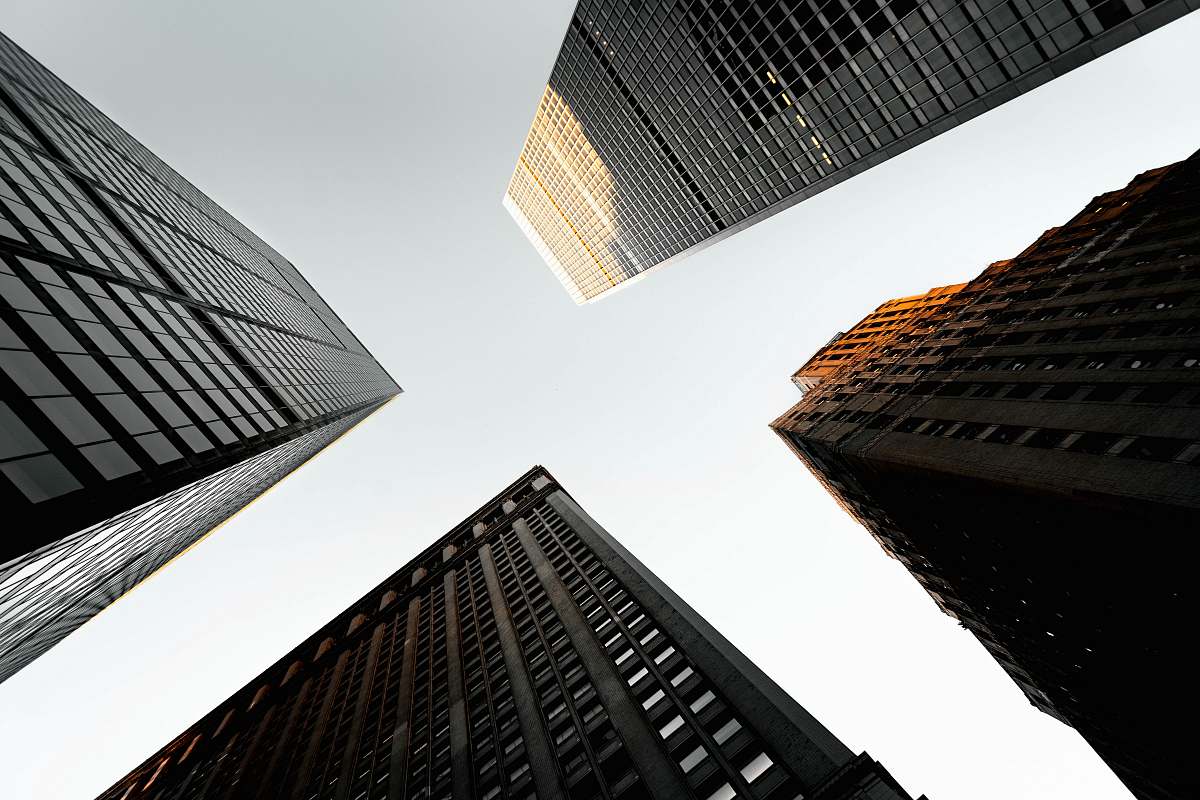 city gray and black concrete building low-angle photography urban