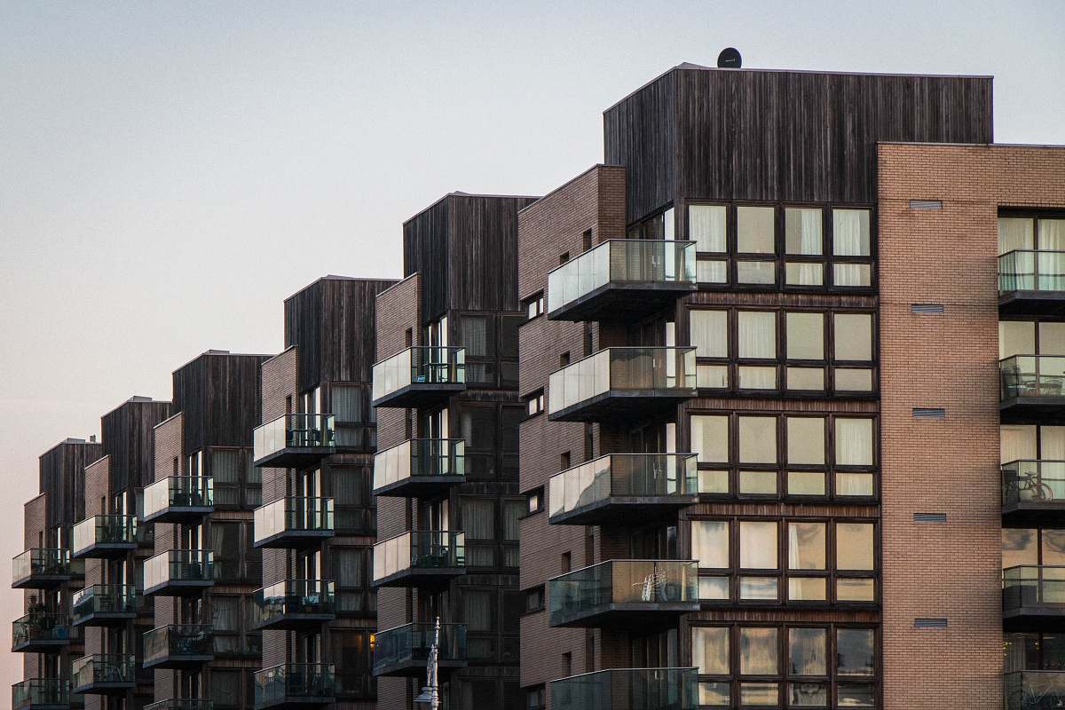 city gray-and-black high rise building high rise