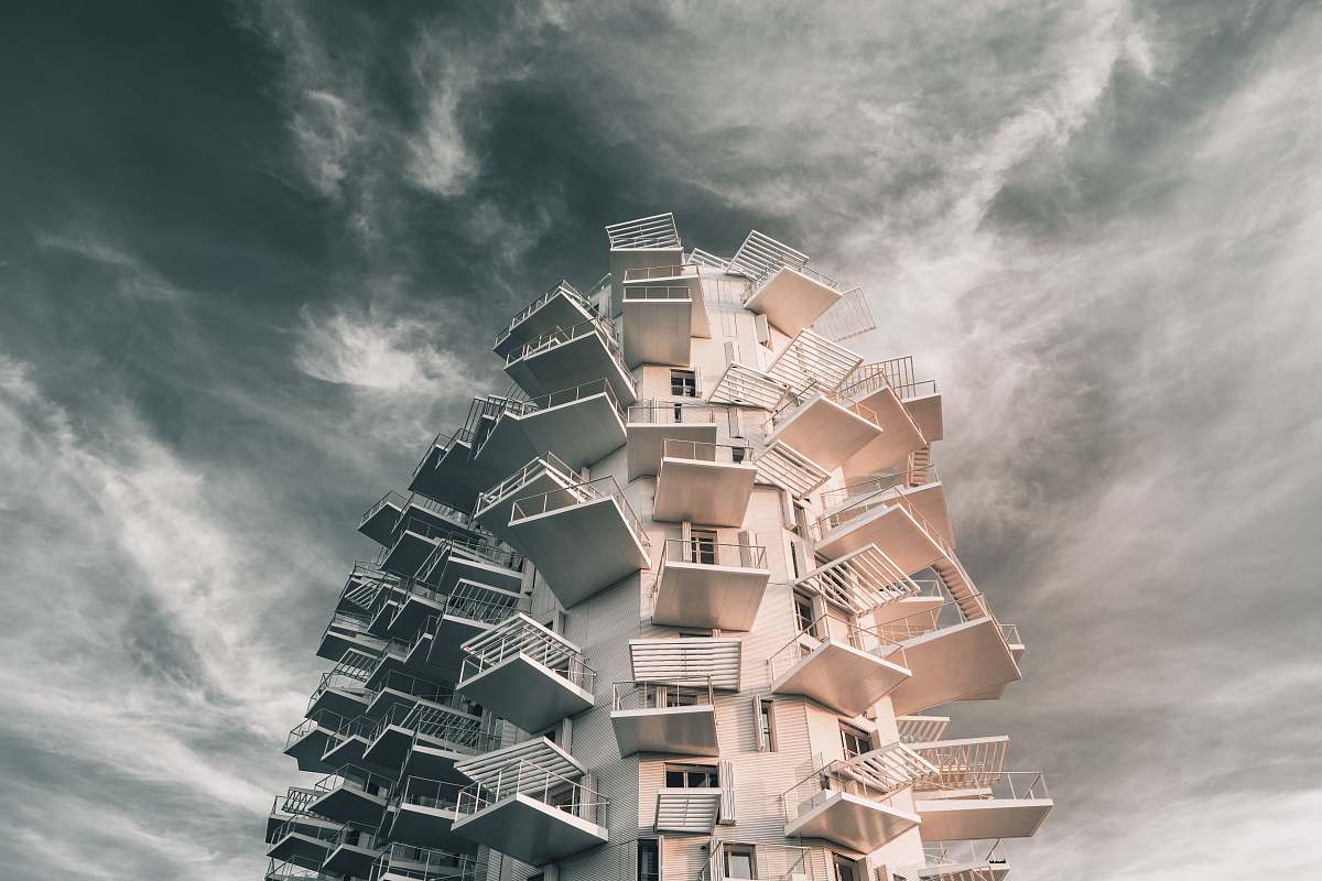 city gray concrete building during daytime high rise