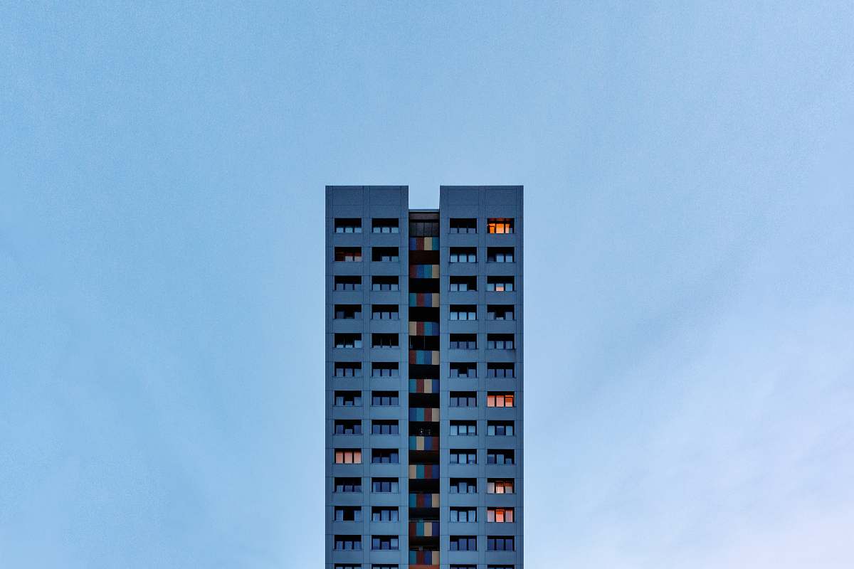city gray concrete building under blue sky high rise
