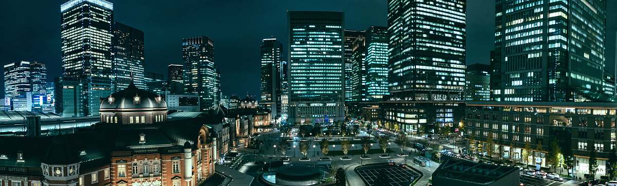 city gray high rise buildings at night town