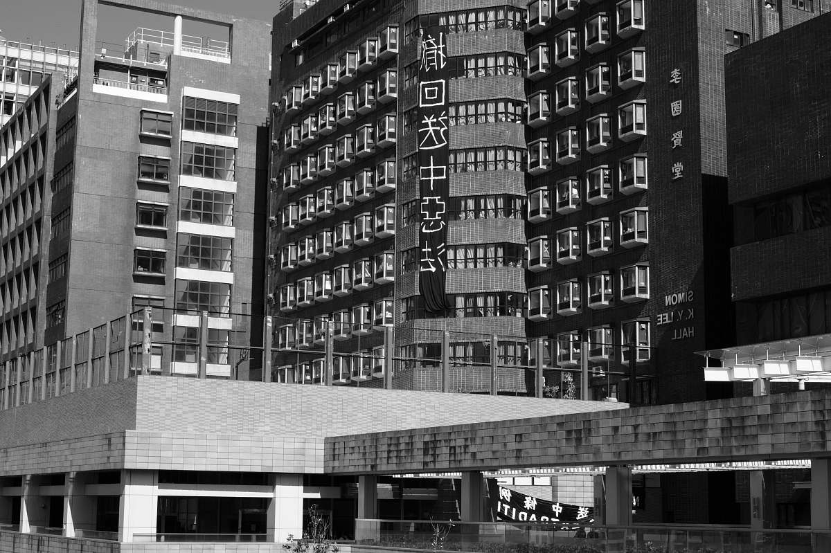 city grayscale photo of buildings during daytime black-and-white