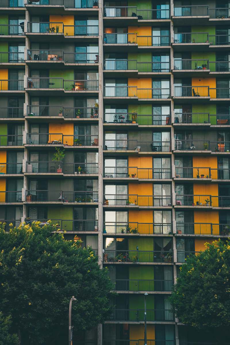 city green and yellow building during daytime high rise