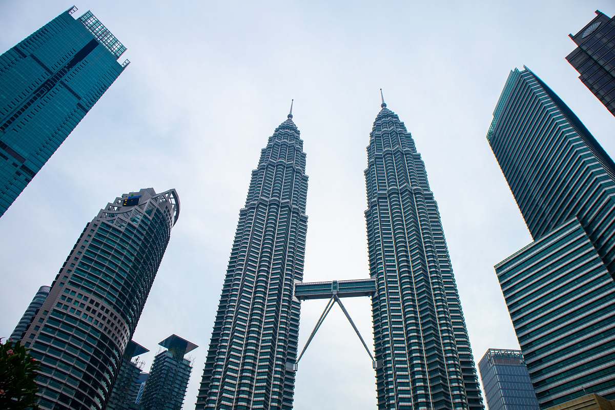 city grey twin tower buildings high rise