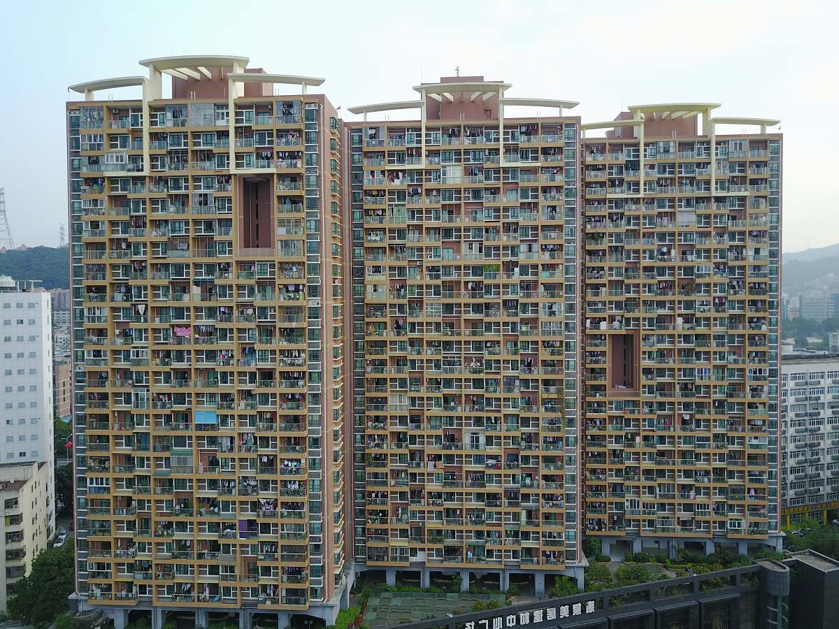 city high-angle photography of brown high-rise building high rise