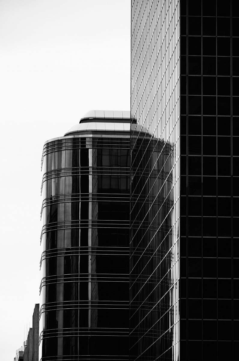 black-and-white high rise building office building