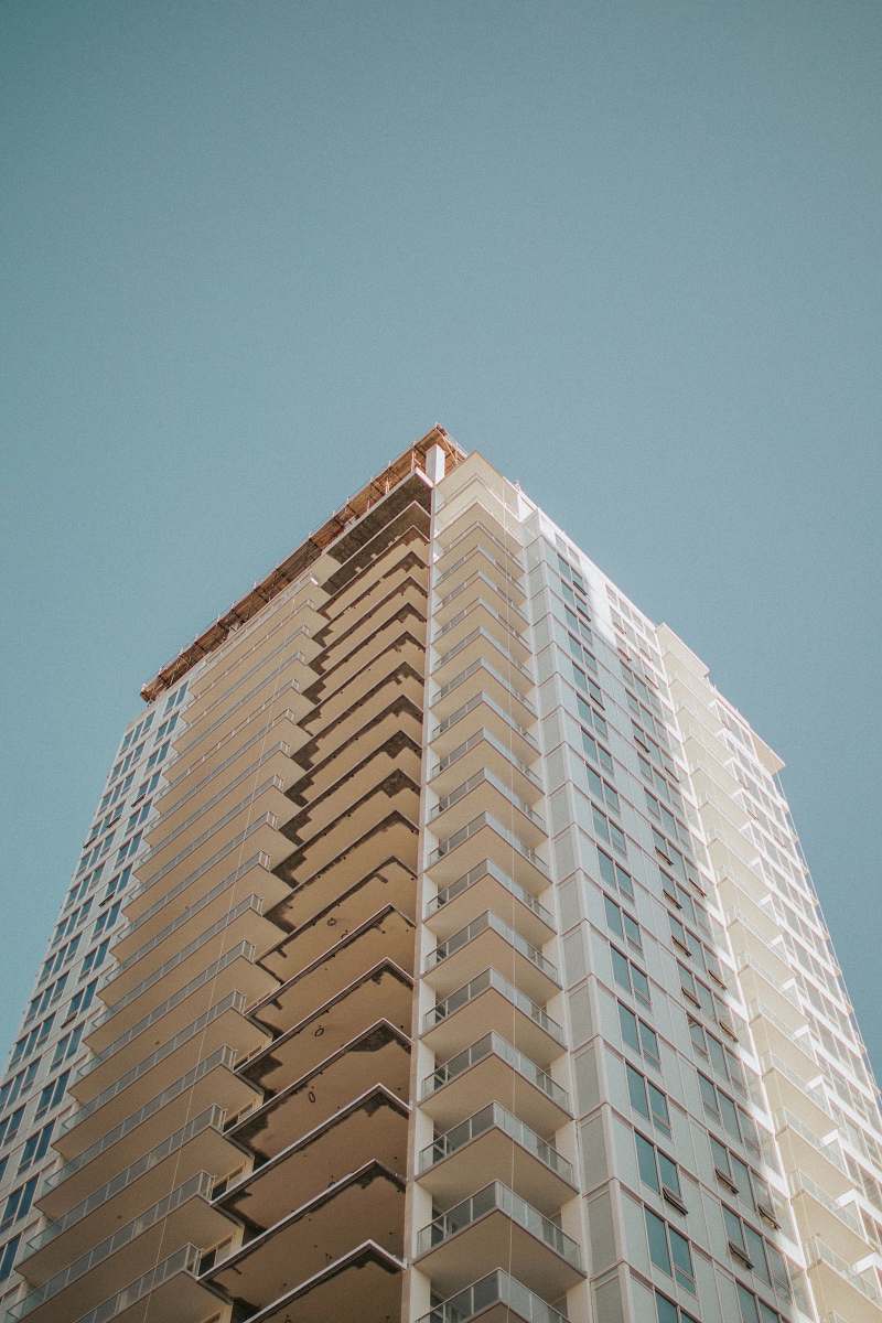 condo high-rise building during day housing