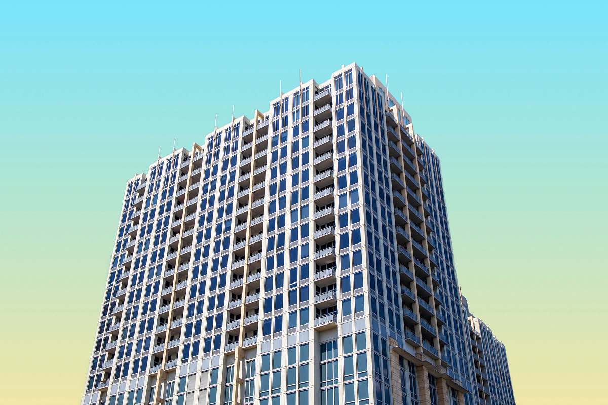 condo high-rise building under blue sky housing