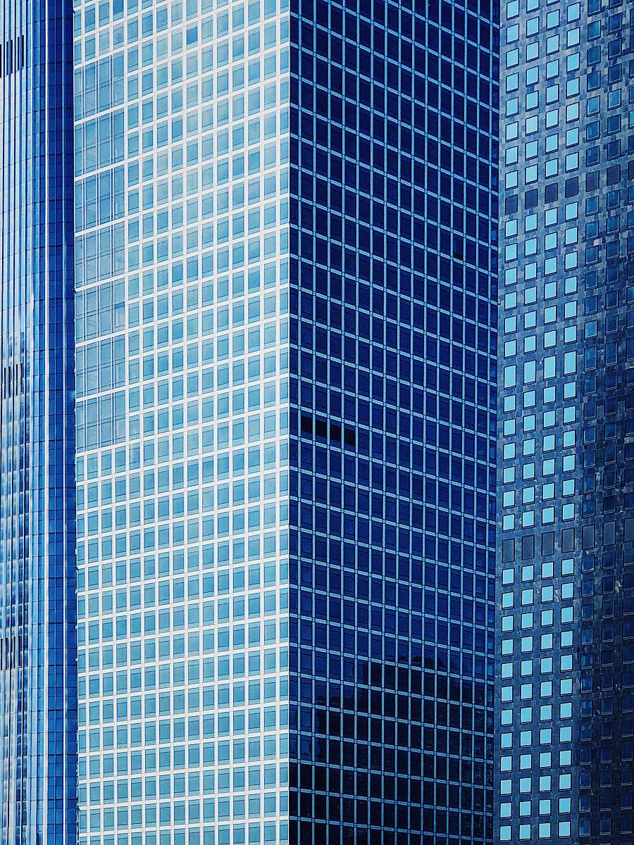 city high-rise building with glass windows view urban