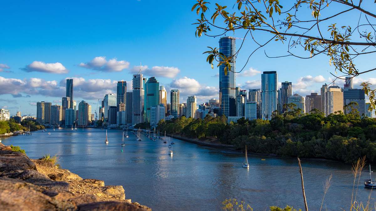 city high-rise buildings near body of water during daytime town