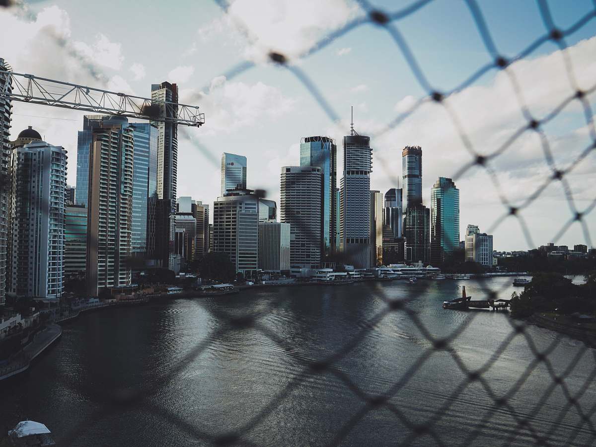 city highrise buildings near sea during daytime town