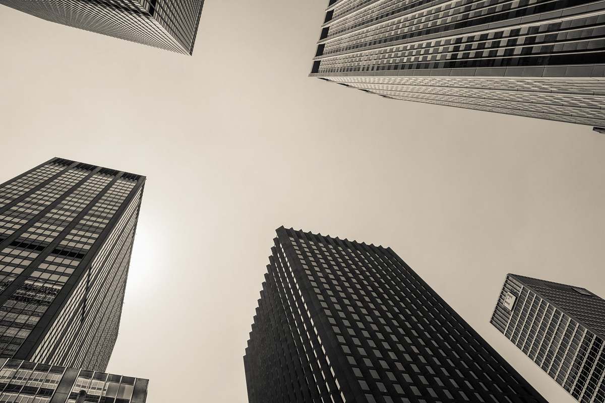 skyscraper low angle and grayscale photography of high-rise buildings architecture