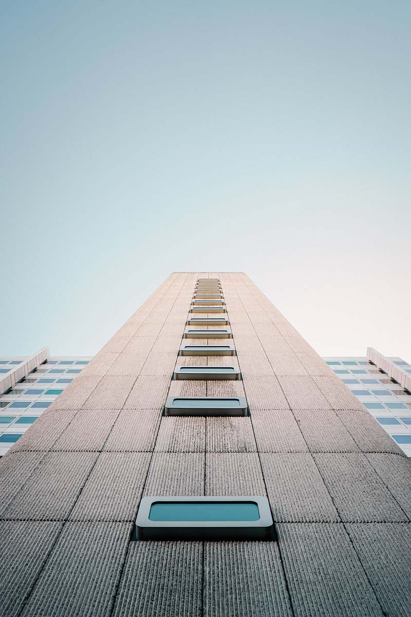 city low angle photo of beige building high rise