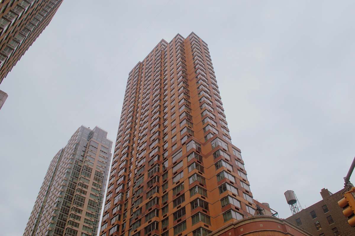 city low angle photo of brown building high rise
