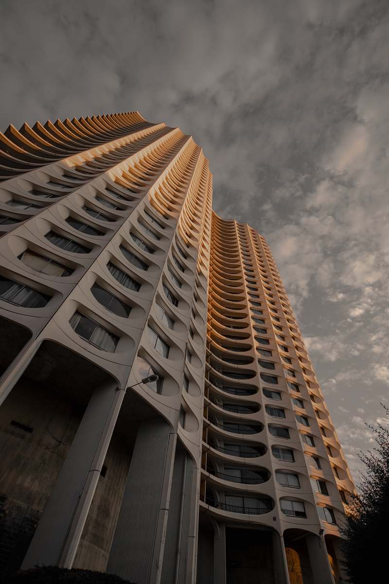 condo low angle photo of concrete building housing
