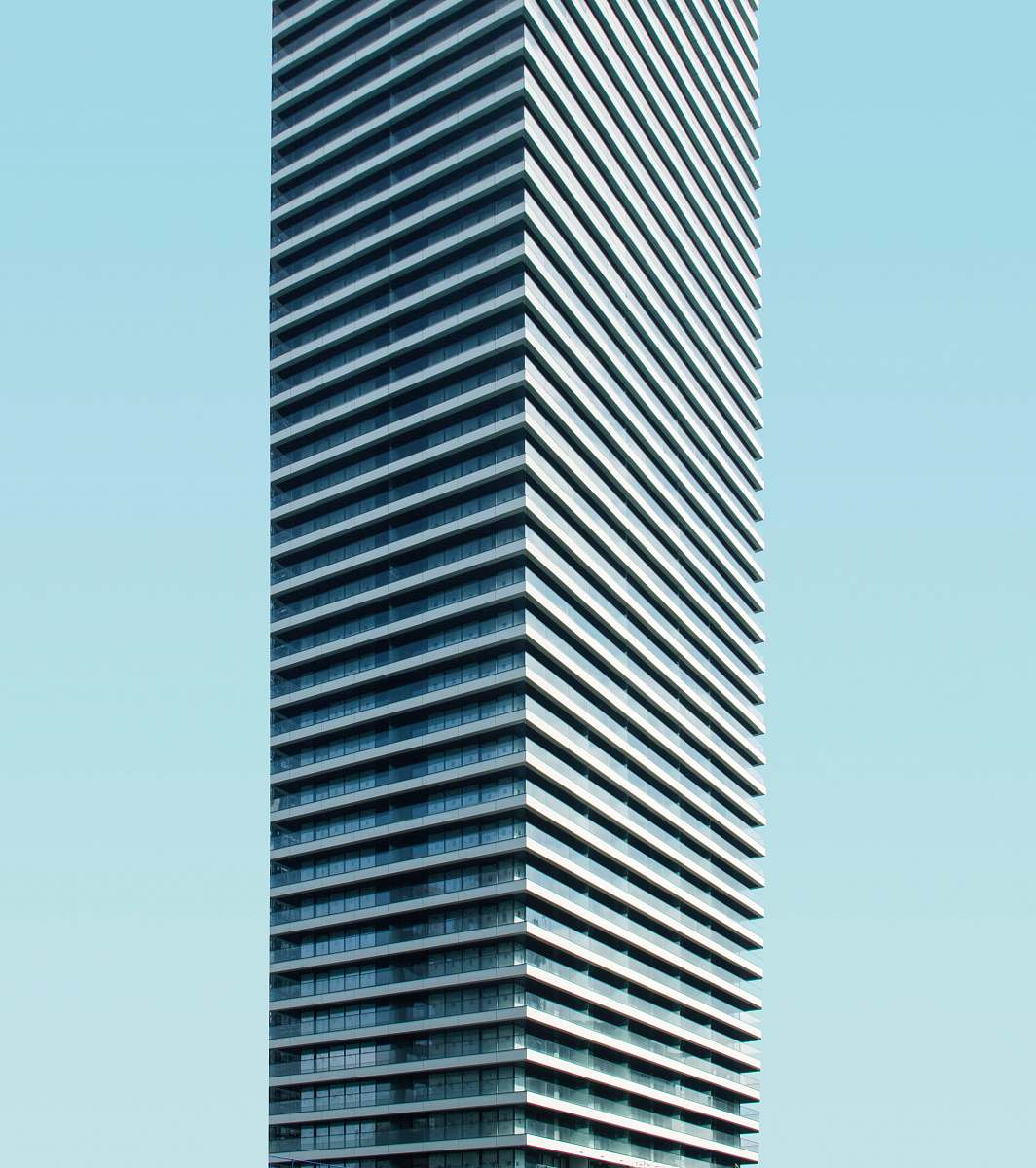 city low angle photo of curtain glass wall building urban