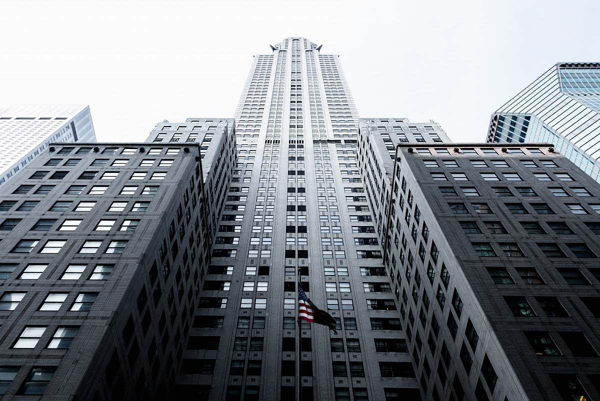 city low angle photo of gray concrete high-rise building architecture