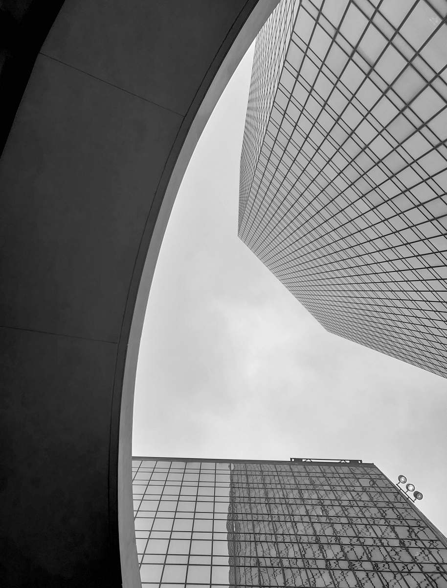 city low angle photo of high-rise building black-and-white