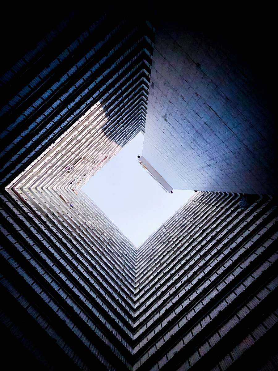 city low angle photo of high rise building during daytime high rise