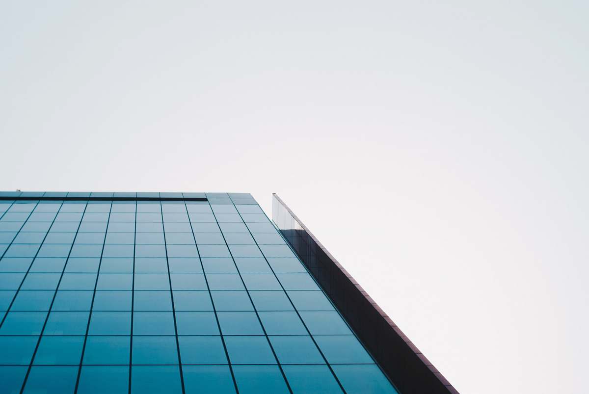 urban low angle photo of mirror building office building