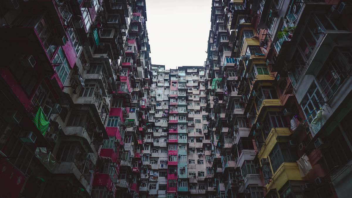 city low-angle photo of multi-colored building high rise