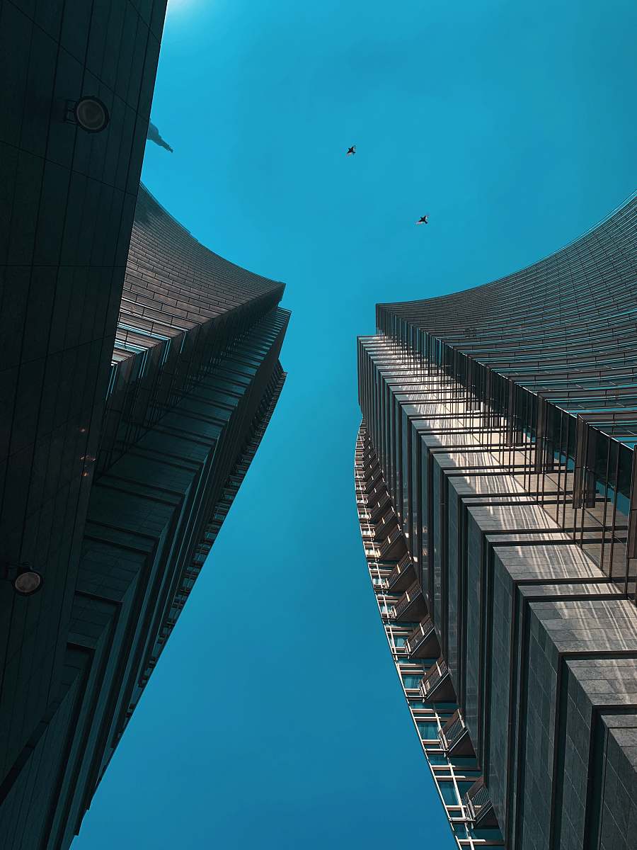 city low angle photo of two high rise buildings high rise