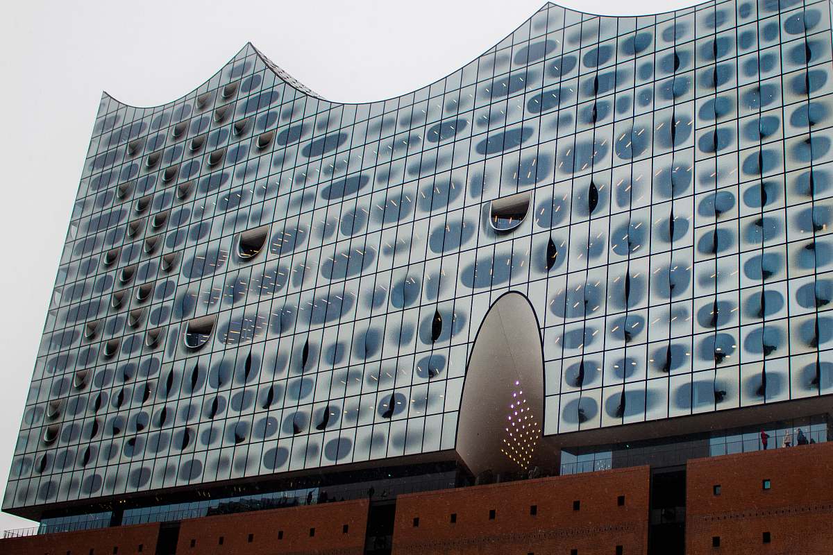 city low-angle photography of blue building office building