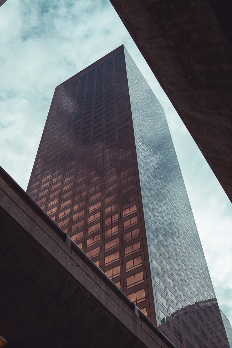 city low angle photography of building under white clouds office building