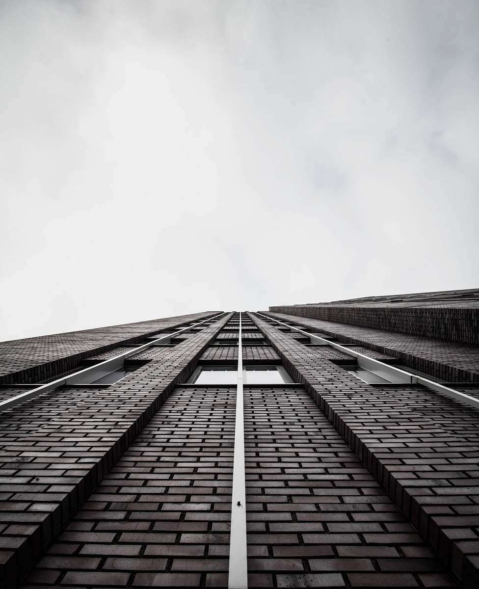 urban low angle photography of building black-and-white