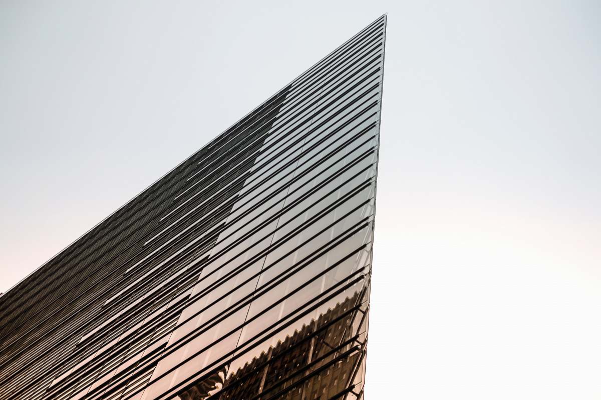 urban low-angle photography of curtain building under white sky during daytime office building