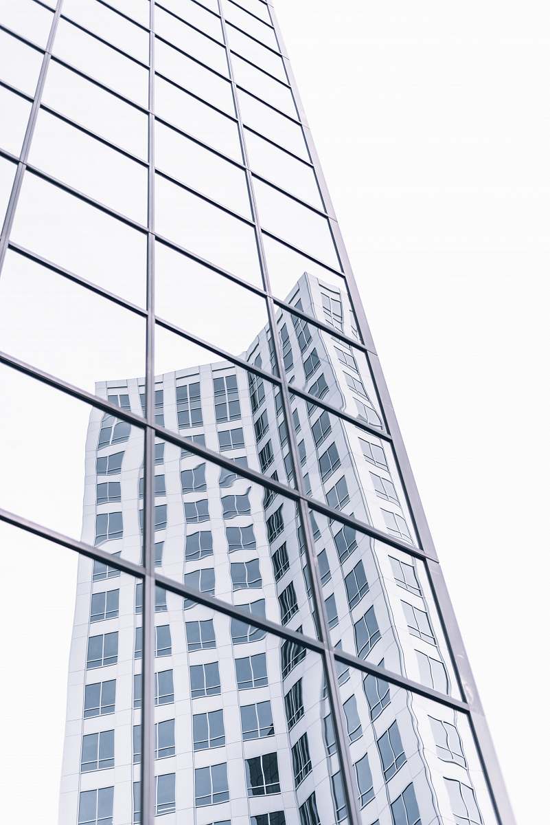 city low angle photography of glass building office building