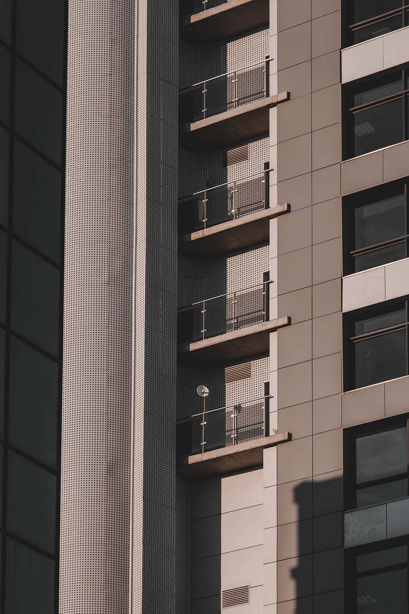 city low-angle photography of gray and black building high rise