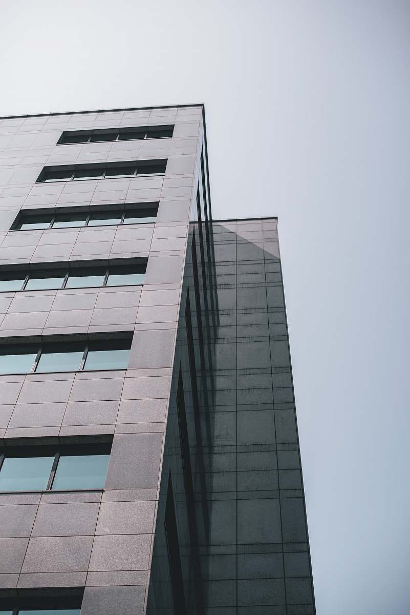 city low-angle photography of gray building high rise