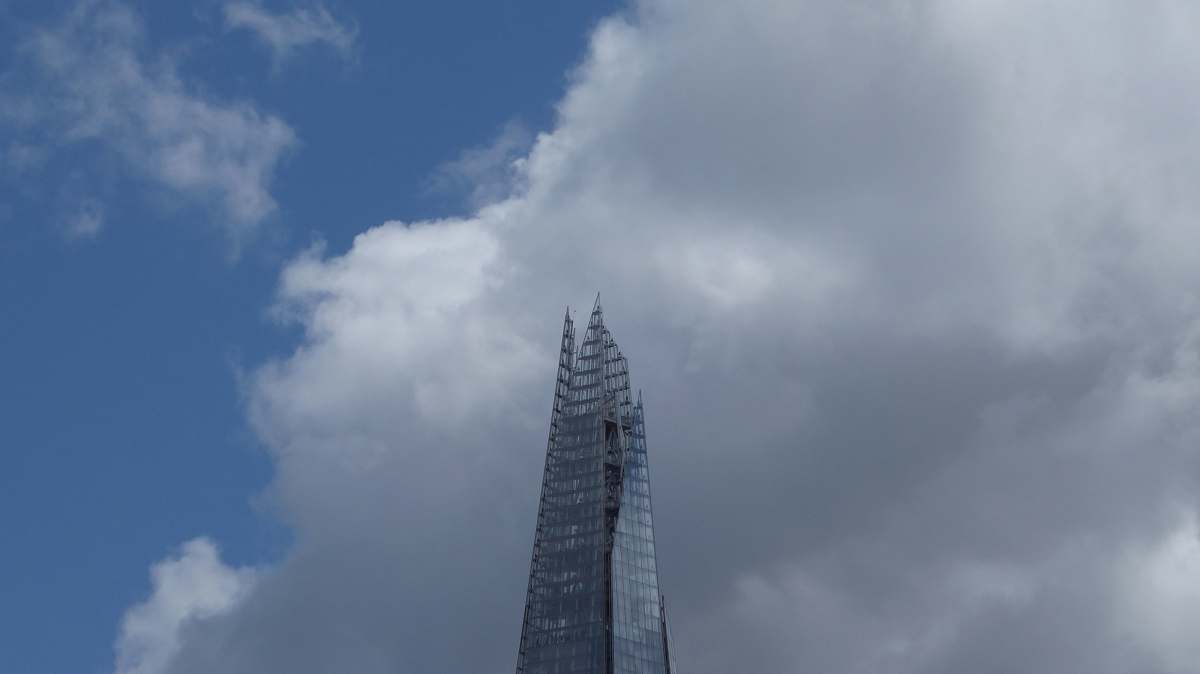 city low-angle photography of gray high-rise building high rise