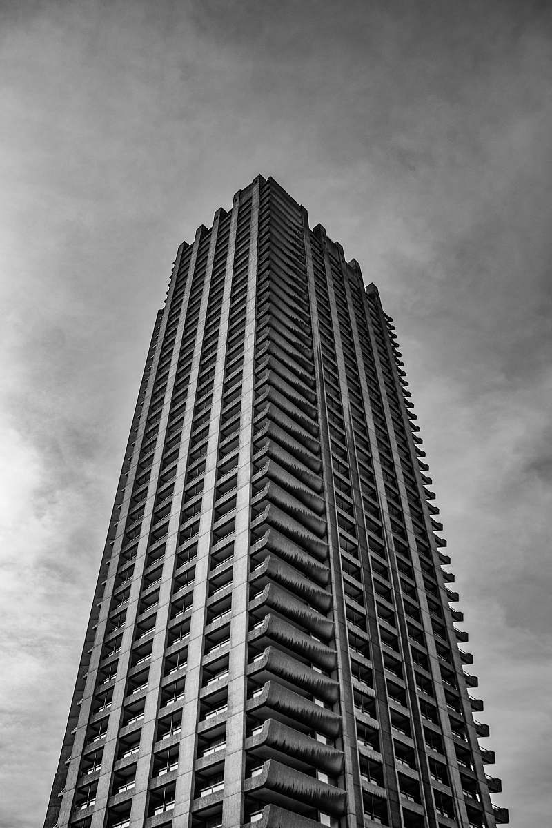 city low angle photography of gray high rise tower black-and-white
