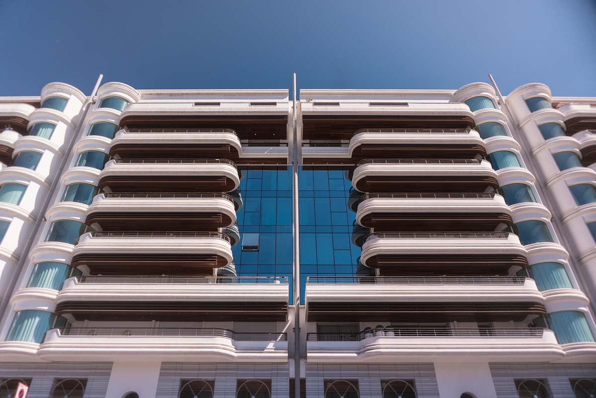 city low-angle photography of grey concrete apartment high rise