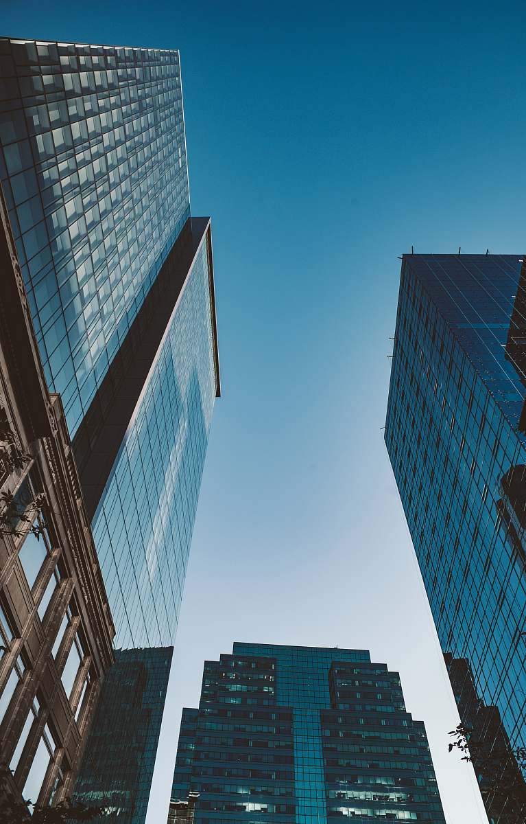 city low angle photography of high-rise buildings under calm sky architecture