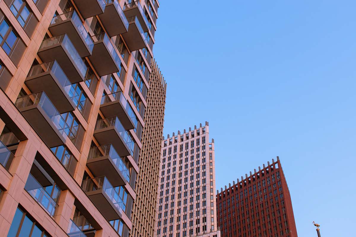 city low-angle photography of red and blue building office building