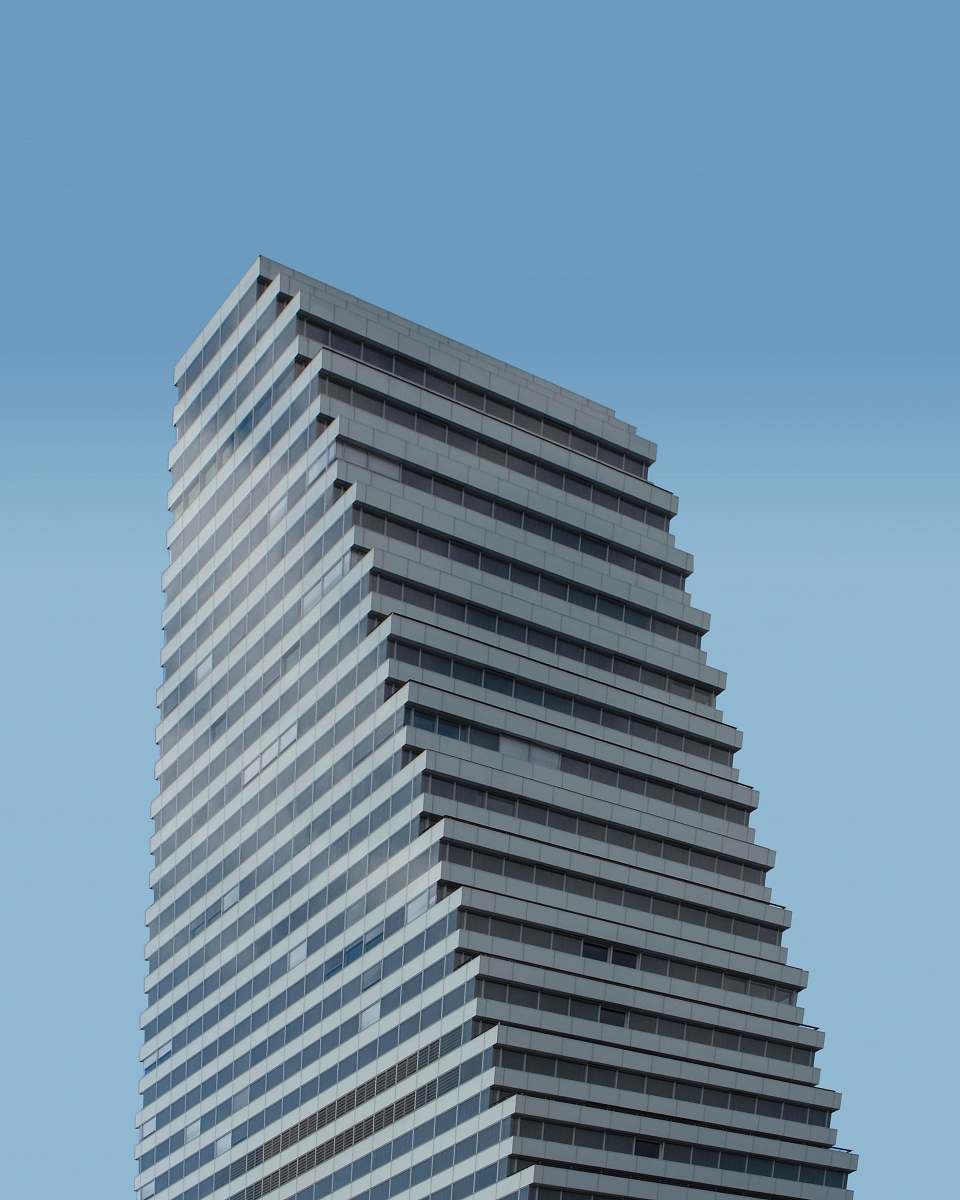 city low angle photography of white concrete building during daytime office building