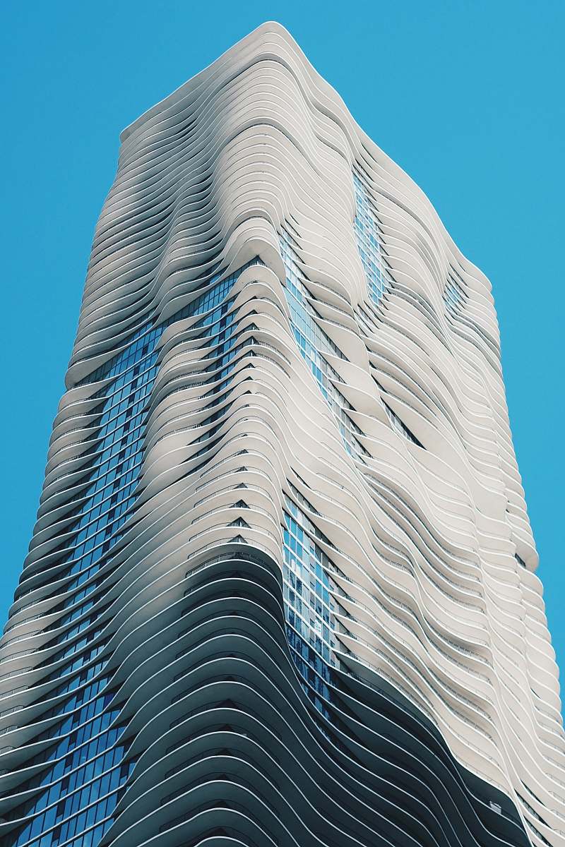 town low angle photography of white high rise building architecture