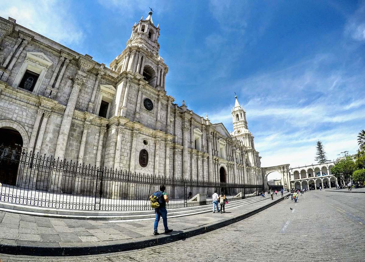 city man walking beside church downtown