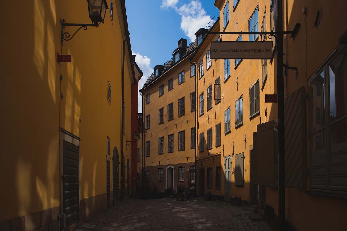 town pathway between buildings at daytime street