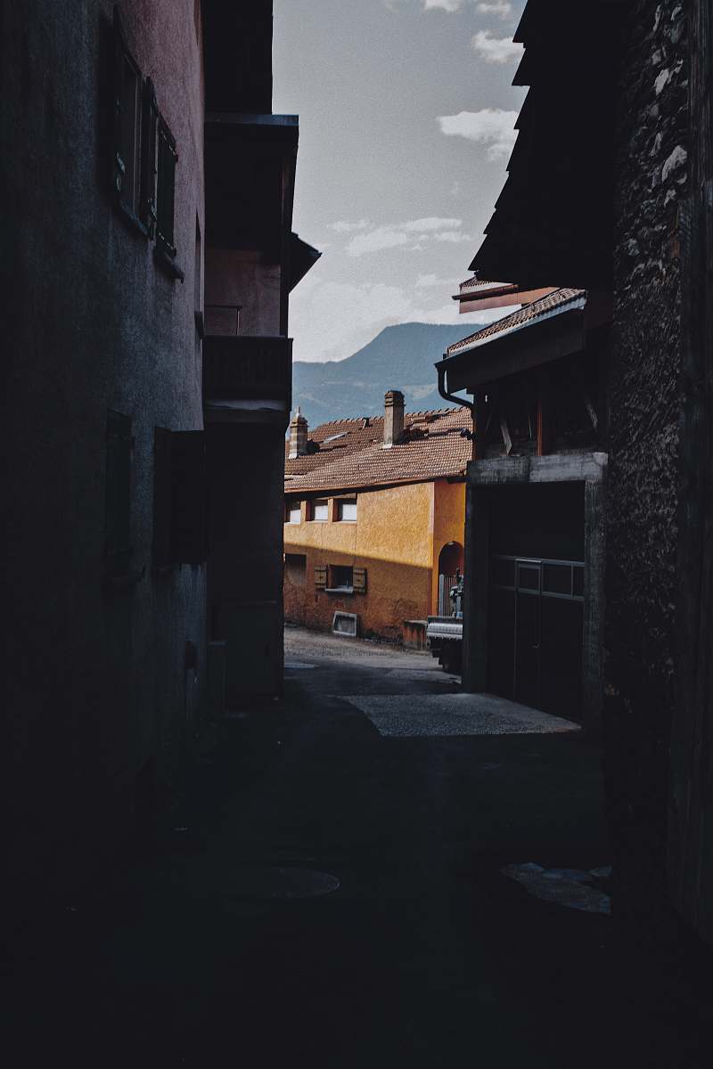 city pathway between buildings road