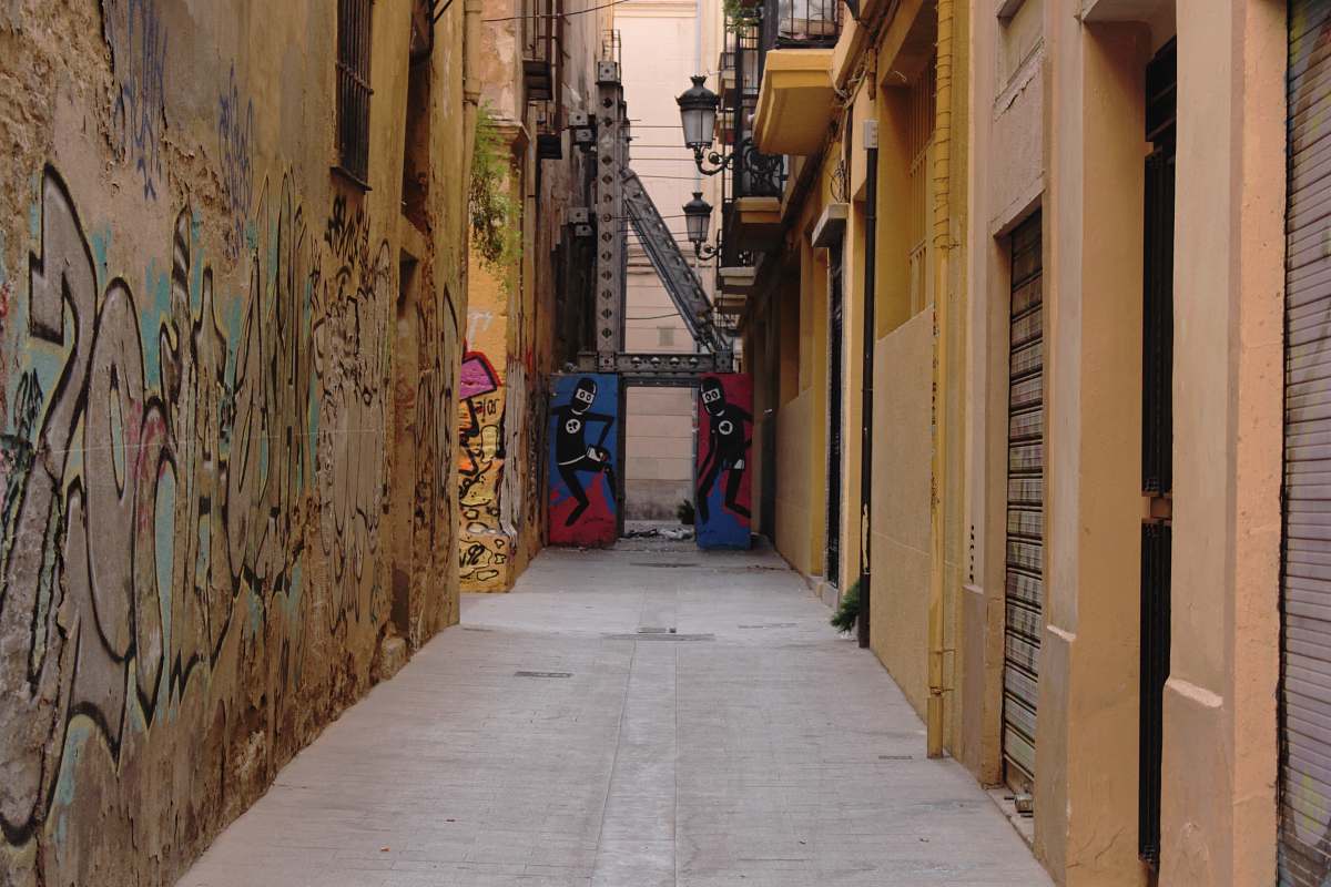 city pathway in middle of buildings road