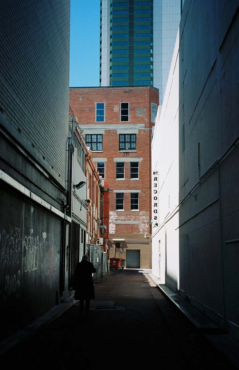 city pathways across brown building road