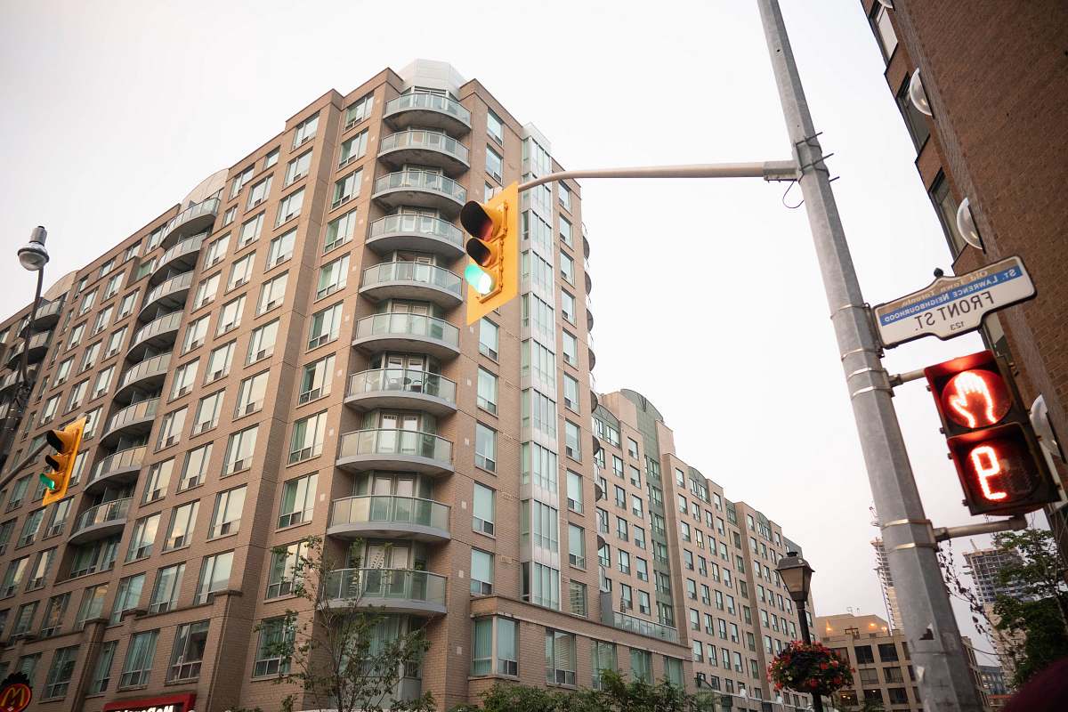 city pedestrian light on stop at 9 seconds high rise